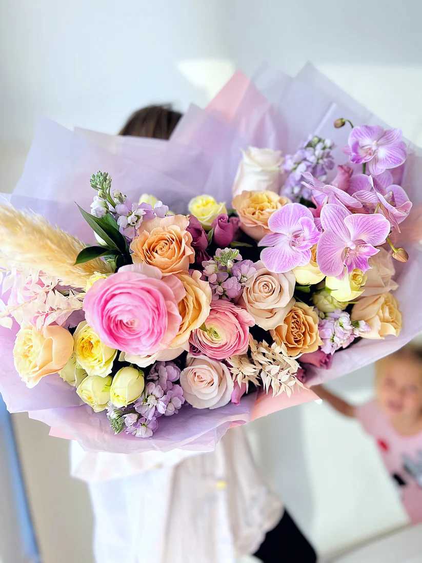 This bouquet could consist of a mix of colorful flowers such as
