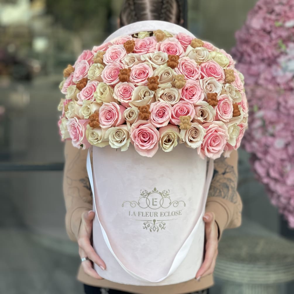 Cute arrangement of pink and sand roses in our signature pink velvet