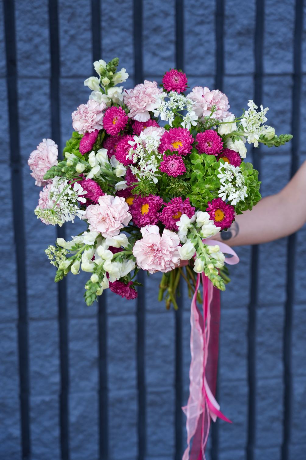 The bouquet could be named &quot;Carnival of Blossoms.&quot; This vibrant arrangement bursts
