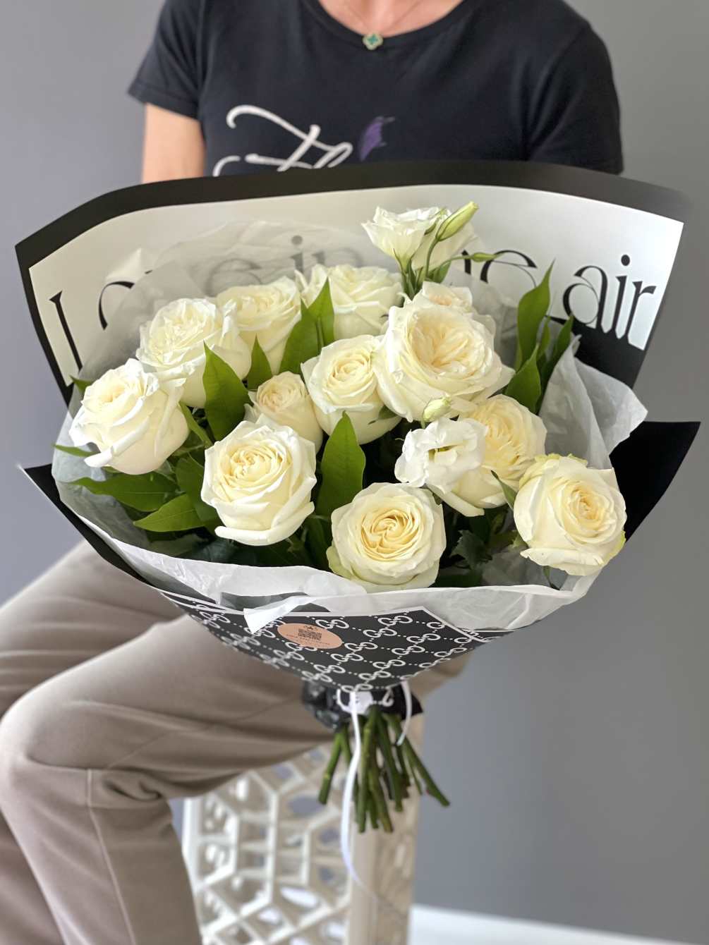 The &quot;Candlelit Elegance Bouquet&quot; is a stunning hand-tied arrangement featuring delicate white