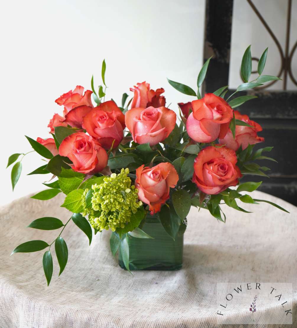A striking bouquet featuring bi-color blush roses, pulsating with vibrant energy and