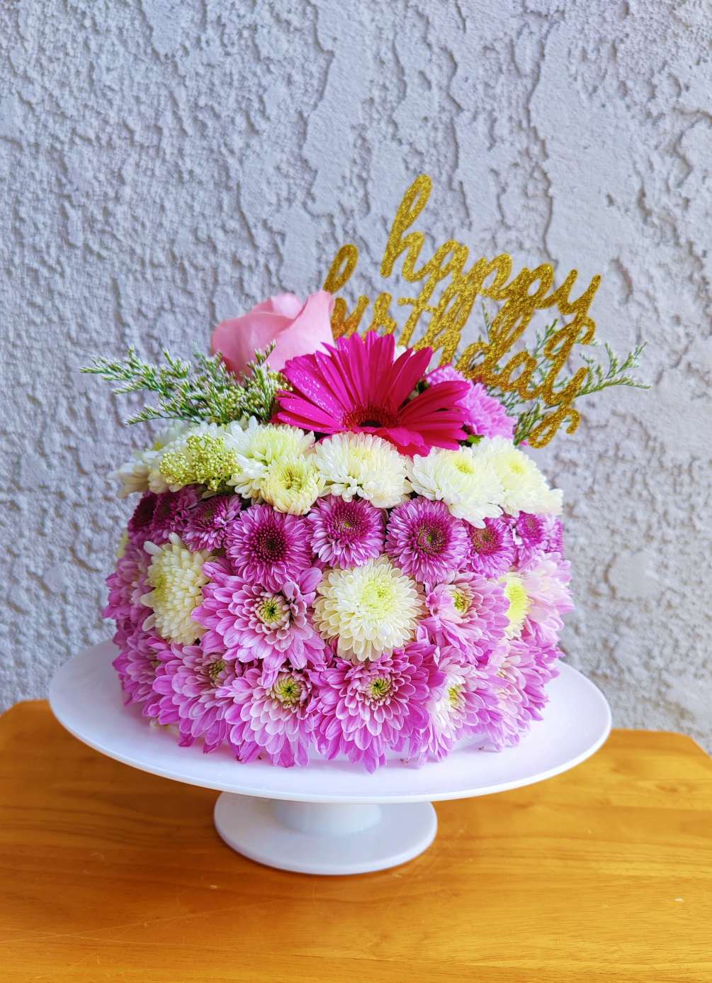 Celebrate with this beautiful floral cake. It&#039;s  decorated with fresh flowers