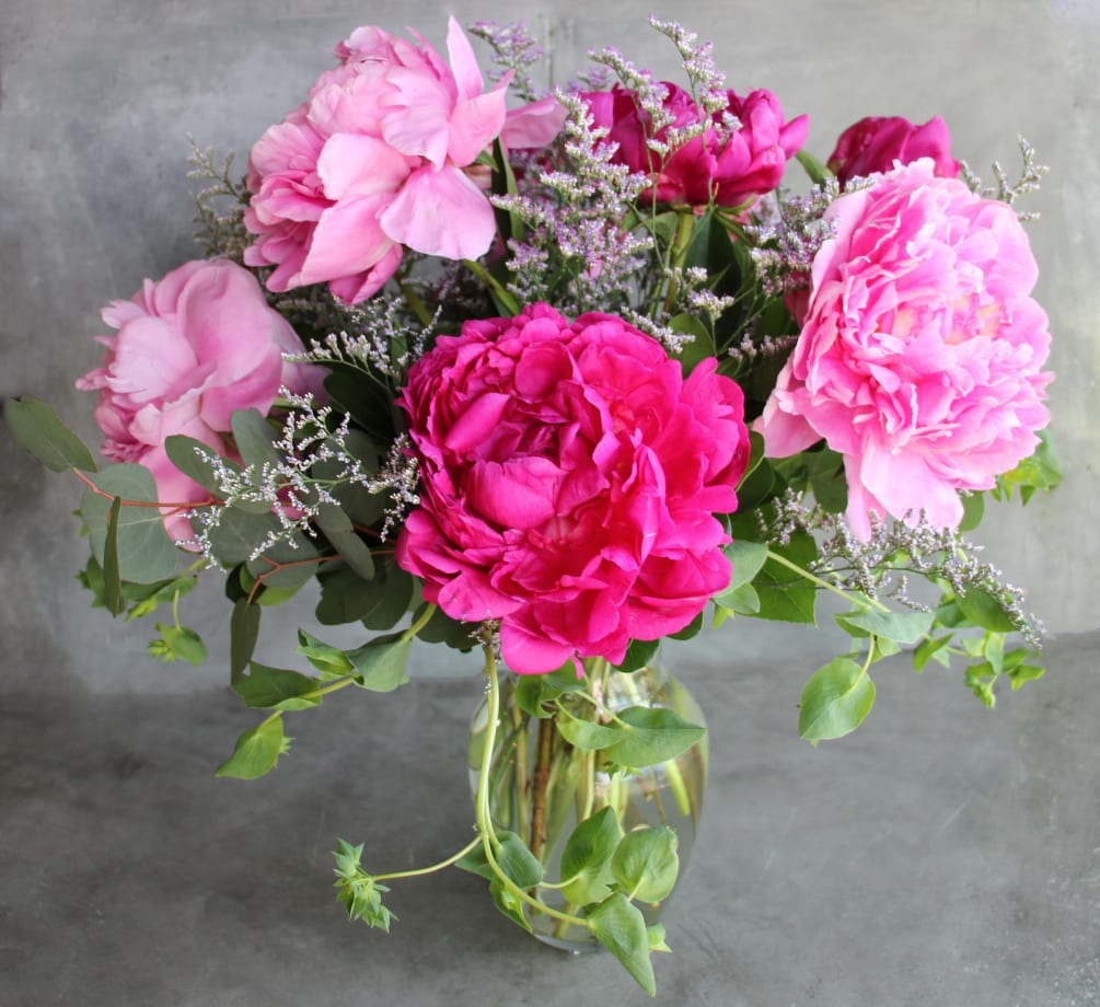 A dozen of our farm grown peonies in a glass vase! The