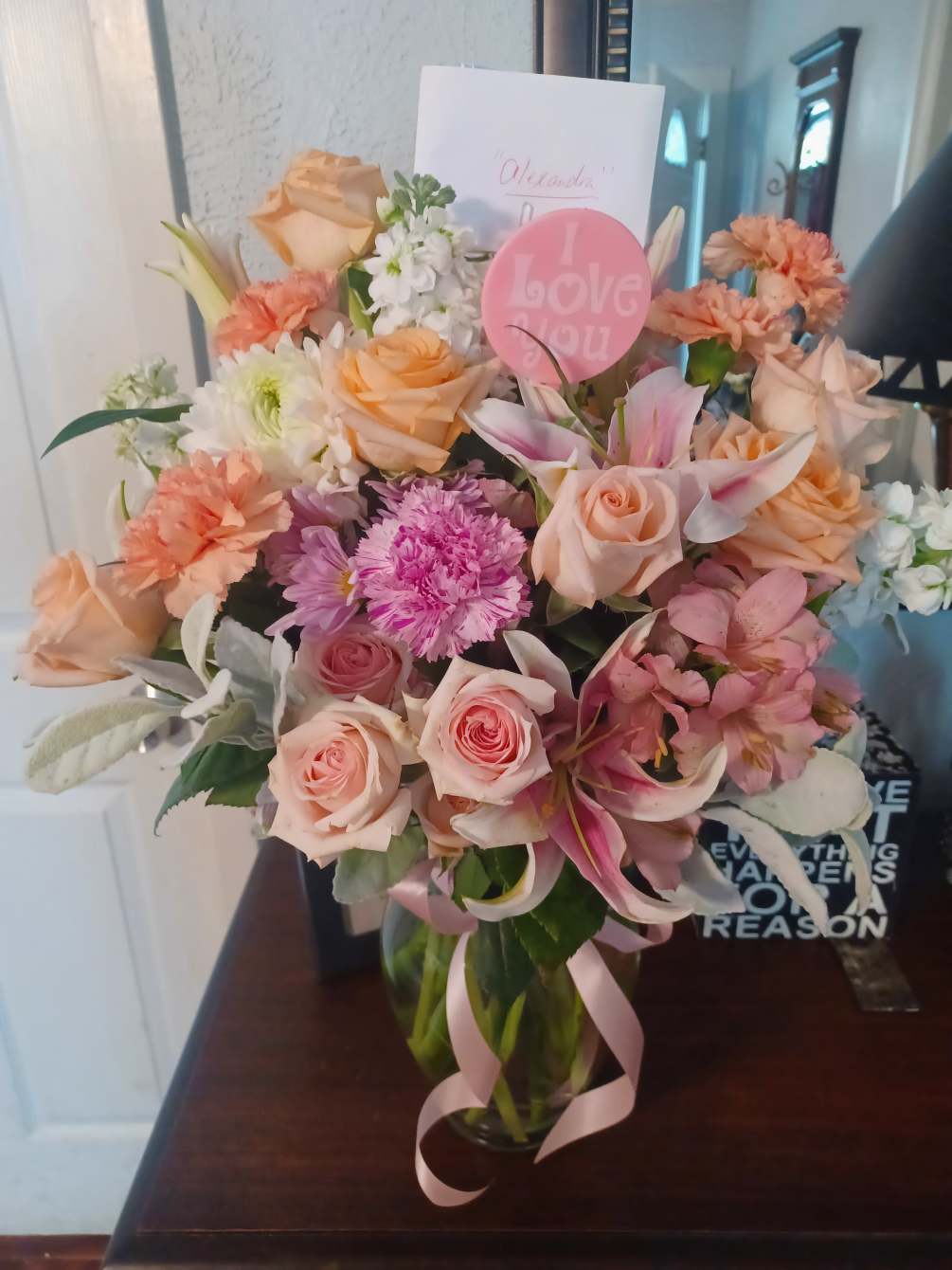A pretty pastel mixture of &quot;artificial and fresh chrysanthemums, lillies and roses