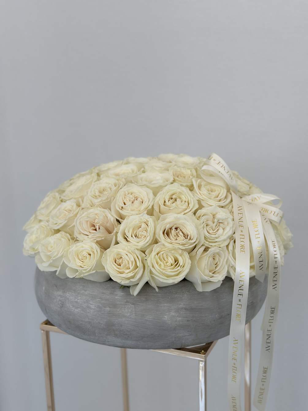 Embrace timeless sophistication with our Ivory Chic Arrangement, presented in a sleek