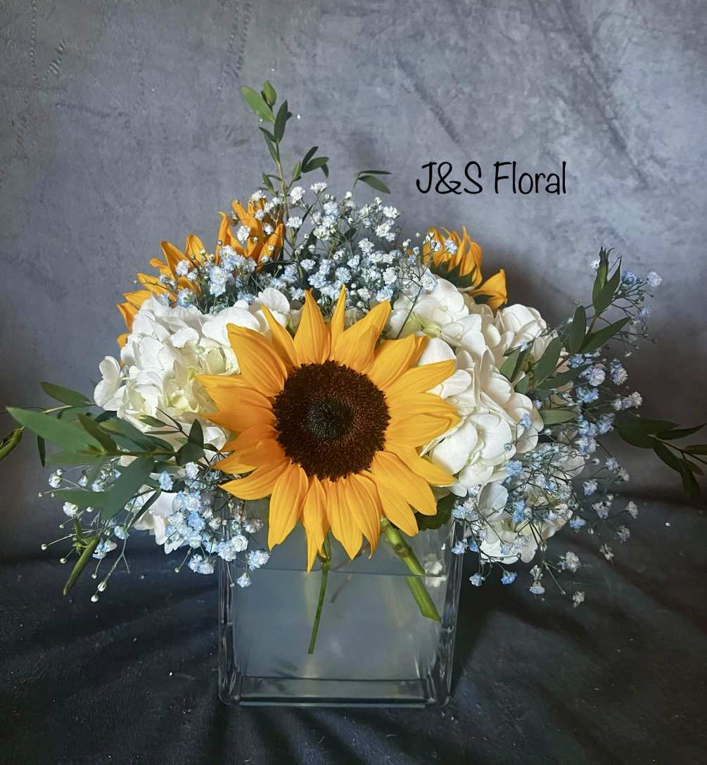 Beautiful Square vase with sunflowers, hydrangeas, blue baby&#039;s breath and greenery
