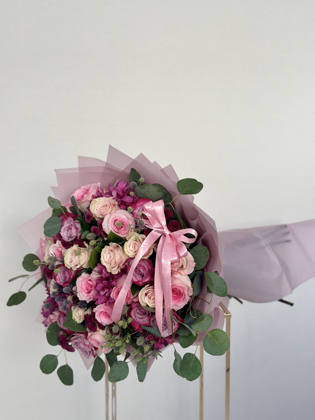 This exquisite bouquet captures the essence of romance and elegance with a