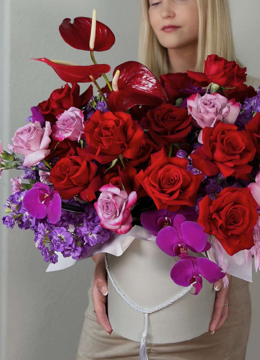 Introducing our elegant hatbox floral arrangement, &quot;Blazing Hearts.&quot; This exquisite design features