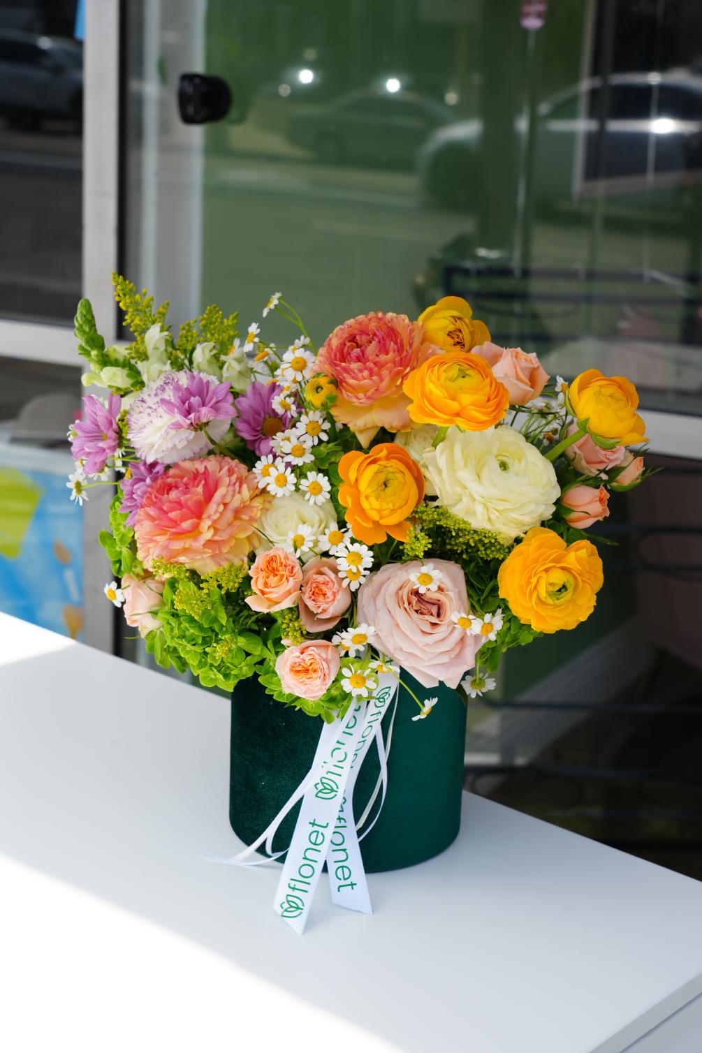 The Sunshine Bliss Arrangement is a vibrant and joyful display of nature&#039;s