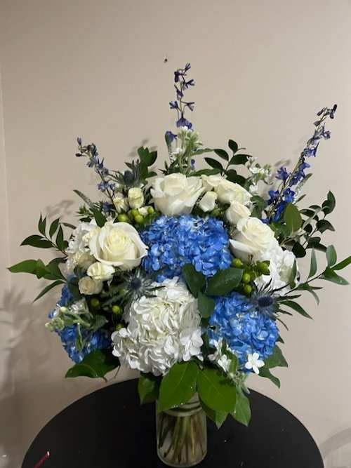 Blue and white Hydrangeas, white roses and greens