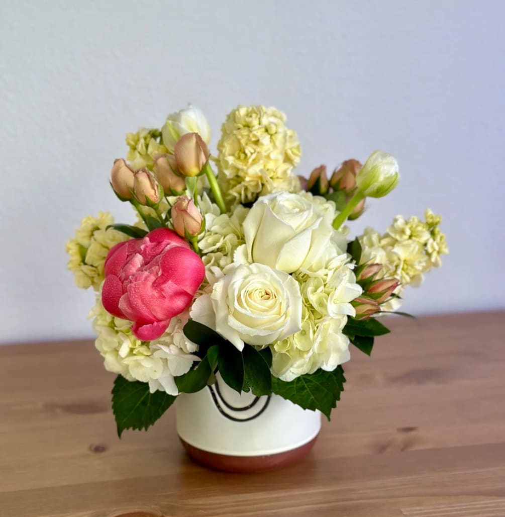A charming floral arrangement crafted with love, showcased in a stunning Lanquin