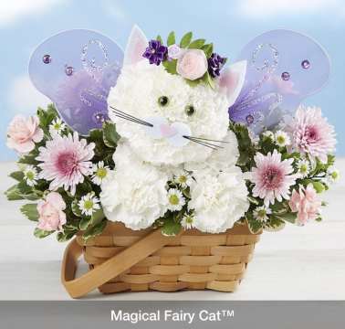 White floral cat arrangement in a wicker basket with purple fairy wings