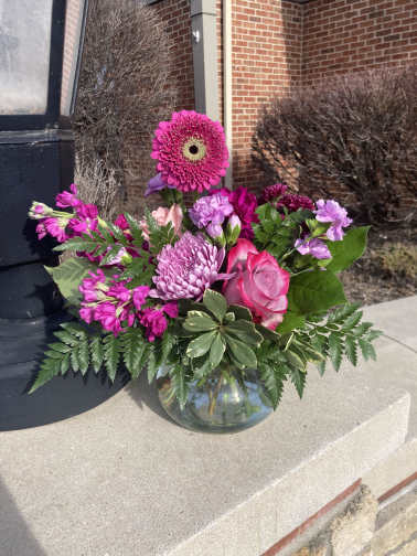 Pink and purple bouquet in a glass vase