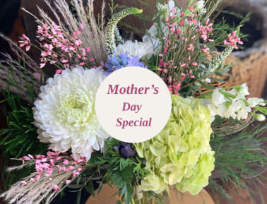 Mixed bouquet with white chrysanthemums, green hydrangea, and pink accents