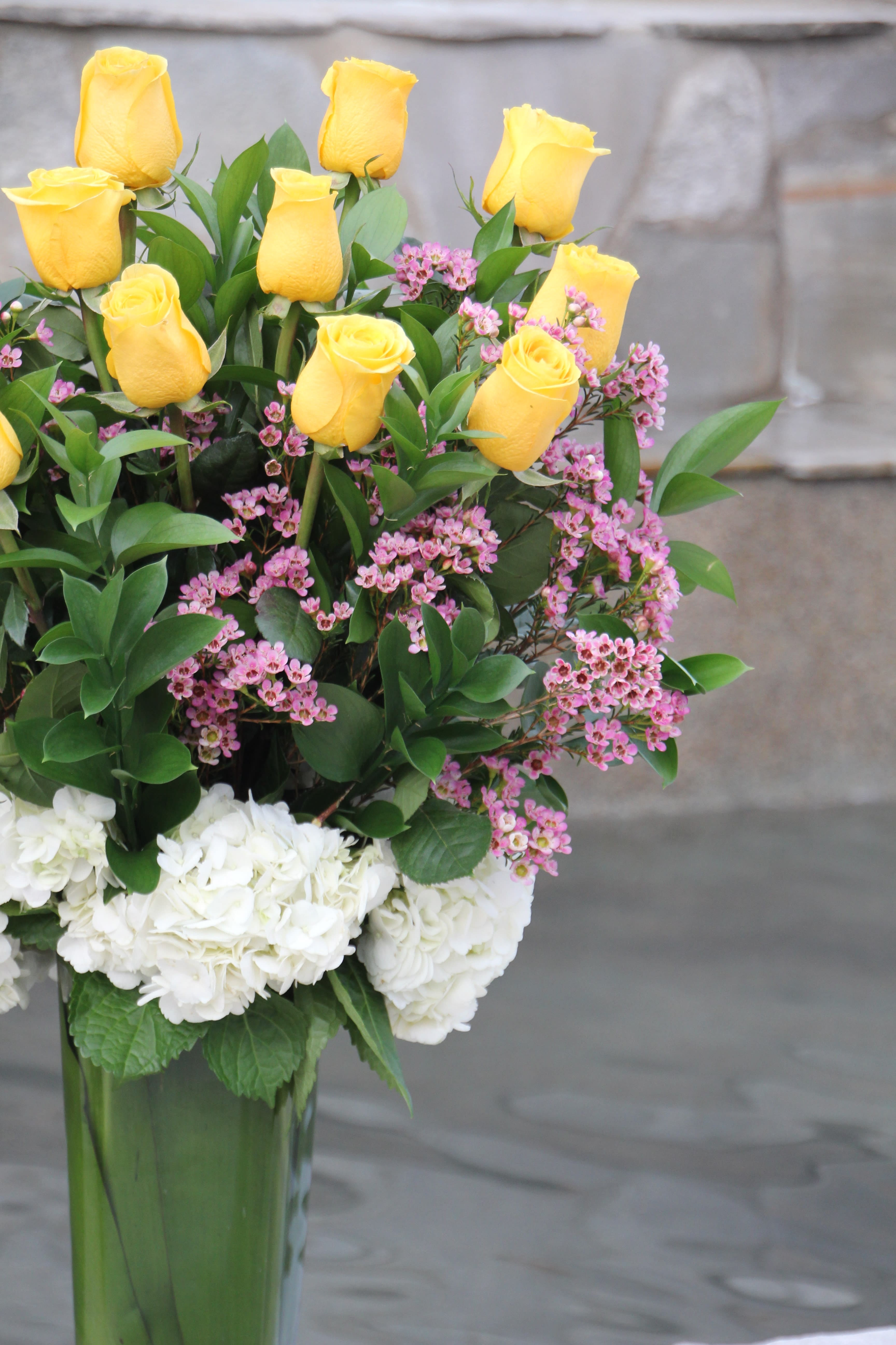Yollie Dozen Long Stem Yellow Roses in a vase in Torrance, CA Andes