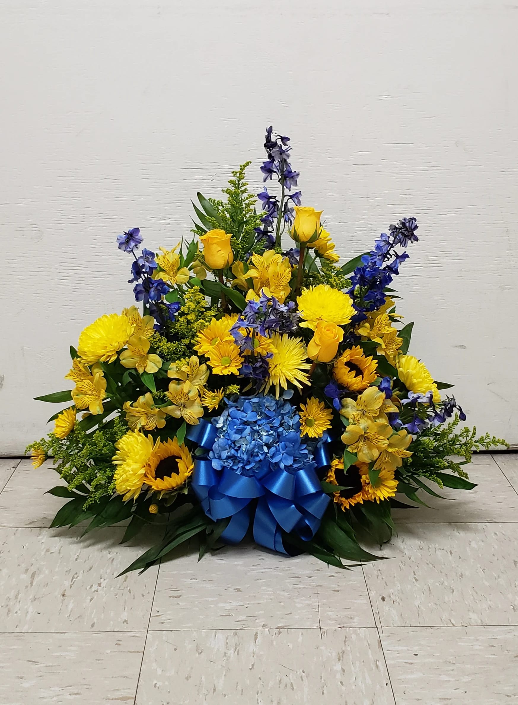 BLUE AND GOLD CEMETERY CENTERPIECE DELUXE by Twin Towers Florist