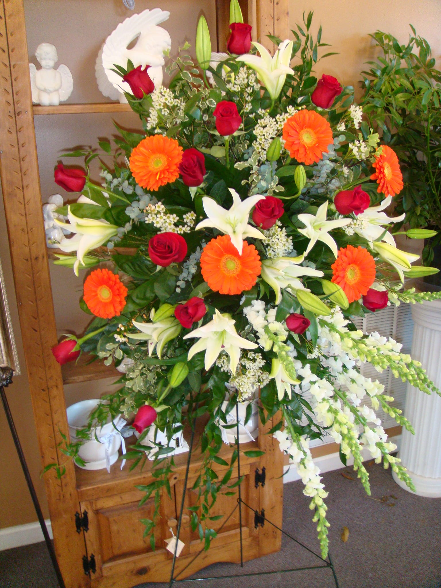 Sympathy Spray Of Roses, Gerber Daisies,Snap Dragons & Wax Flowers in