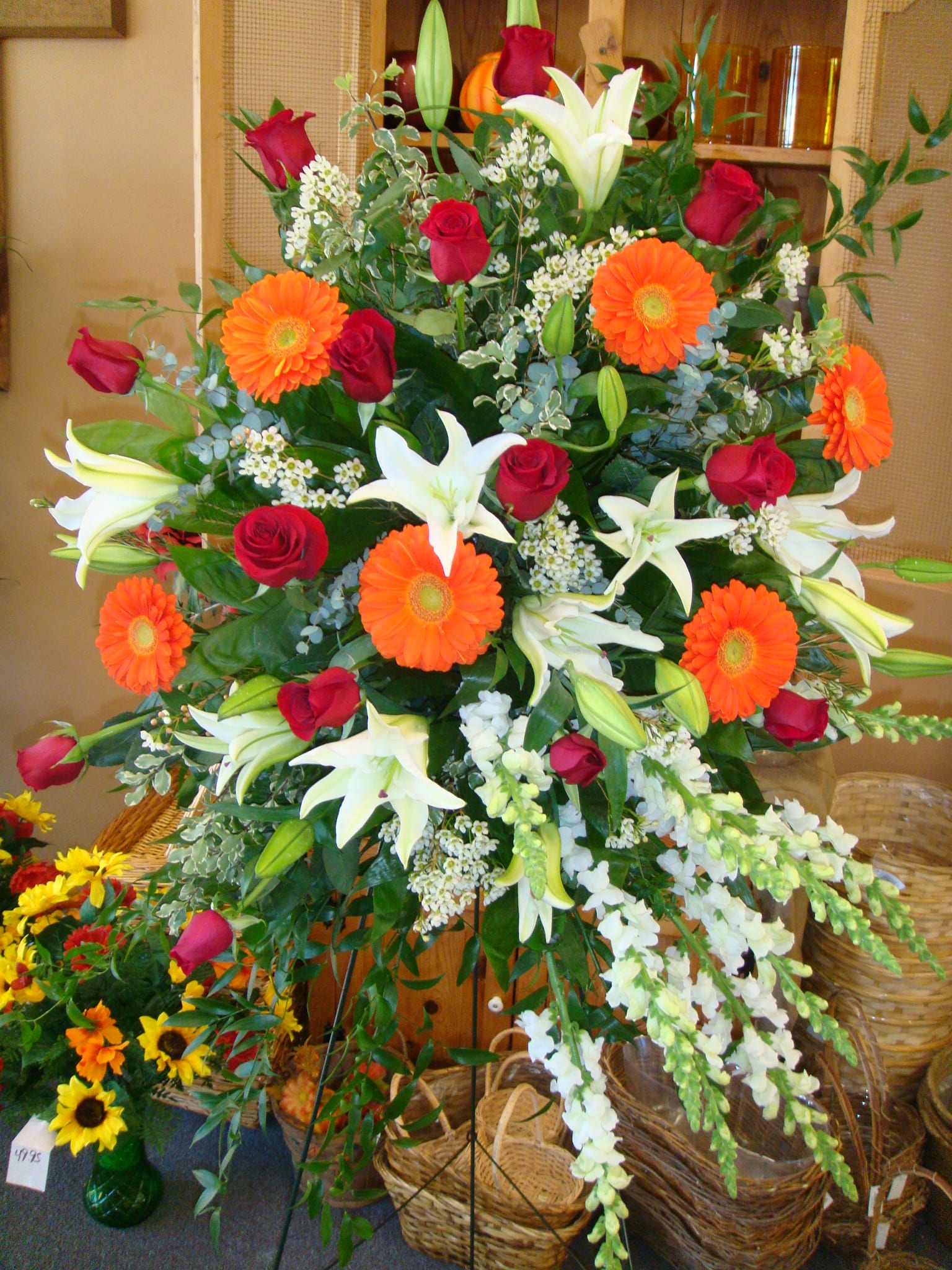 Sympathy Spray Of Roses, Gerber Daisies,Snap Dragons & Wax Flowers in