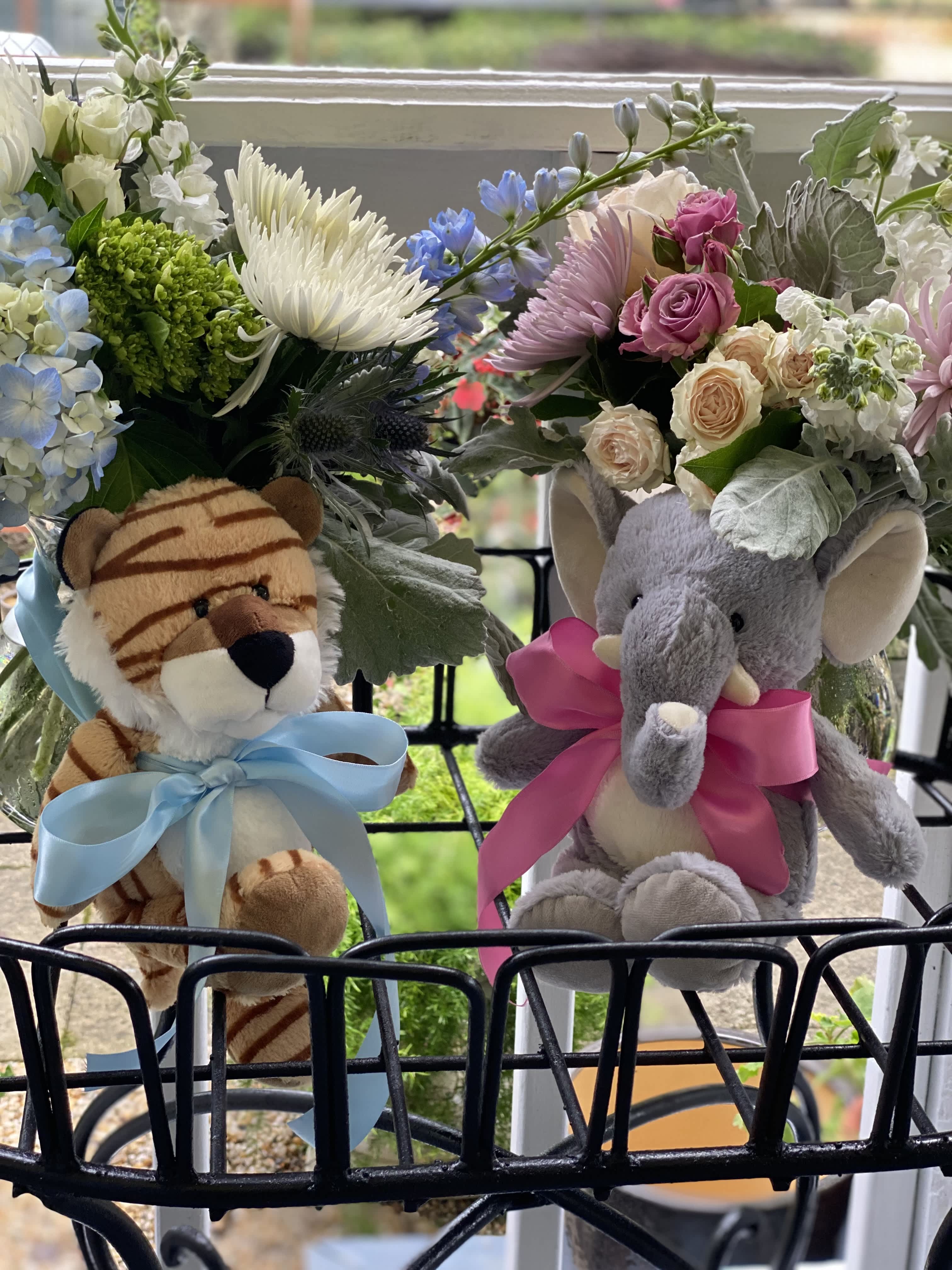 Flowers with stuffed animals top