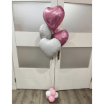 Cluster of heart-shaped balloons in pink, silver, and white
