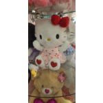 Hello Kitty plush toy in a pink heart dress with a teddy bear below
