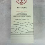 Boxed scented soy candle with mountain line art and text
