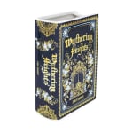 Decorative hardcover book with a dark floral cover and gold lettering