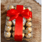 Gift box of gold-wrapped chocolates tied with a red ribbon