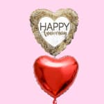 Two heart-shaped balloons, one reading Happy Anniversary