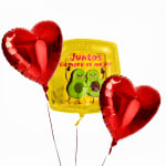 Three heart balloons and a yellow avocado balloon with Spanish text