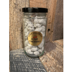 Jar of dark chocolate sour cherries with a black lid