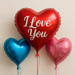 Heart-shaped balloons reading "I Love You" with two smaller heart balloons