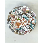 Round bowl filled with assorted inspirational stickers and a clear lid