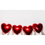 Hands holding four red heart-shaped balloons against a white background