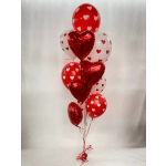 Cluster of red and white heart-shaped balloons tied together