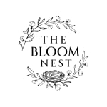 Black floral logo with the words The Bloom Nest