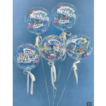 Five clear birthday balloons with ribbons against a blue background.