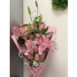 Pink lily and rose bouquet wrapped in pink paper