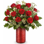 Red roses arranged in a red glitter vase