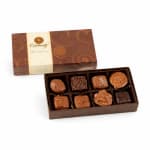 Box of assorted chocolates with a decorative lid