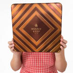 Person holding a large Bonnie & Pop gift tin