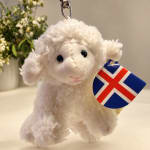 White plush lamb keychain with a flag tag