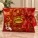 Red chocolate gift box with a gold ribbon and bow