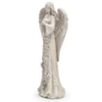 White angel figurine with folded hands and wings