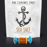 Bag of sea salt caramels with one wrapped caramel in front