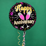 Black anniversary balloon with champagne glasses and hanging ribbons