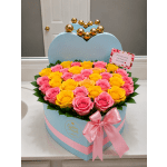 Heart-shaped box of pink and yellow roses with a pink ribbon