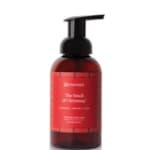 Red pump bottle of hand soap on a white background