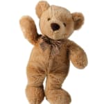 Plush teddy bear with a plaid bow on a white background