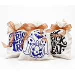 Three Halloween treat bags with ribbon bows and spooky graphics